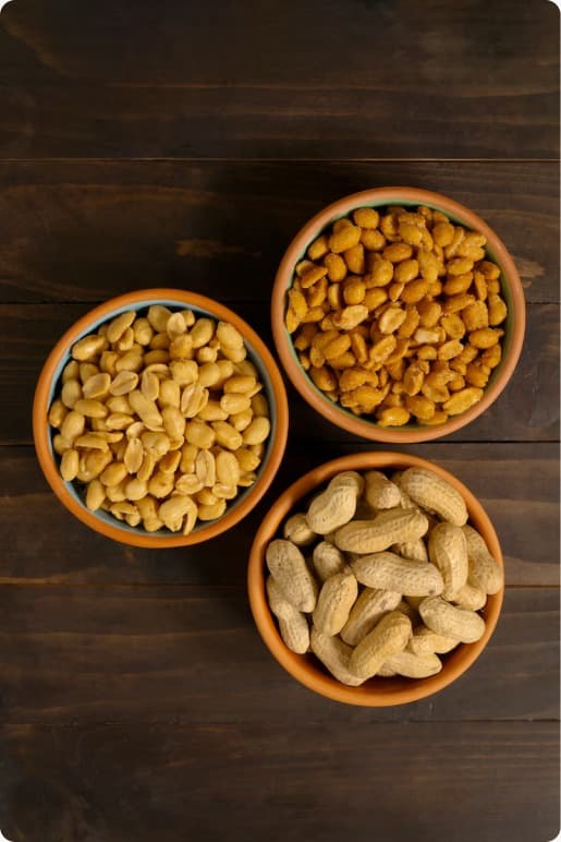 Assorted organic nuts displayed in rustic bowls